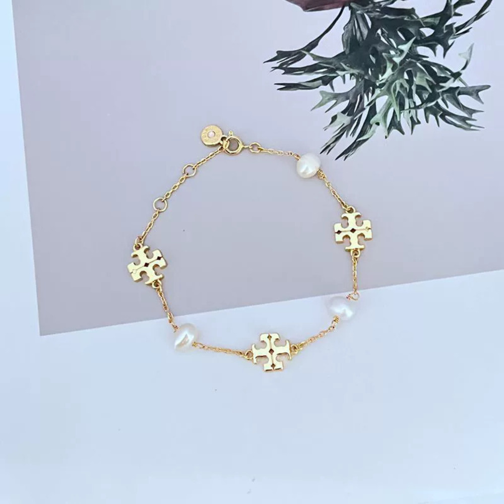 Tory Burch Natural Pearl Letter Metal Bracelet